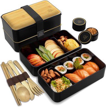 Japanese-style bento box with sushi and utensils