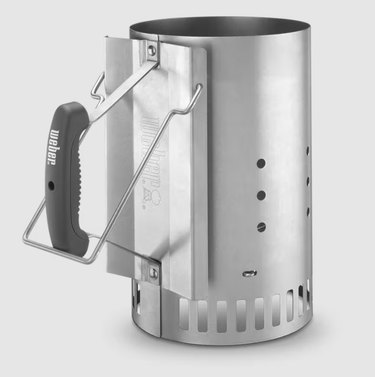 A metal, cylindrical, ventilated chimney starter with a rubber handle lights charcoal faster and safer than lighter fluid.