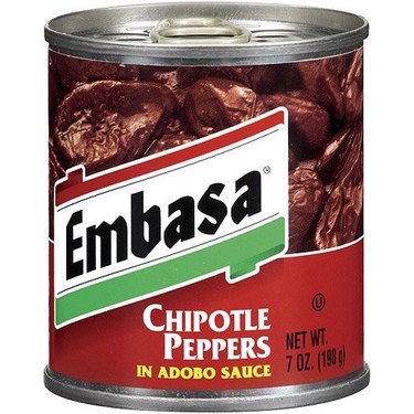 A 7-ounce can of Embasa chipotle peppers in adobo sauce against a white background. The can has a pull-tab.