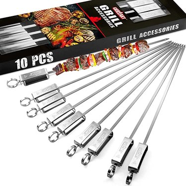 Nine 17" skewers. These extra-long skewers have handles that can hang off the grill (no more burnt fingers!) and have a slider handle that pushes food onto your plate.