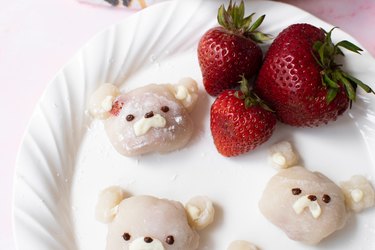 Mochi bears on a plate with strawberries