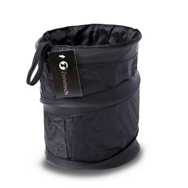 Collapsible black trash can for the car against a white background.
