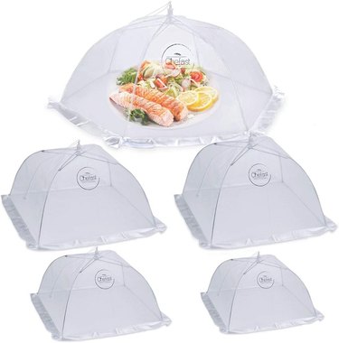 Five white mesh pop-up food tents of assorted sizes.