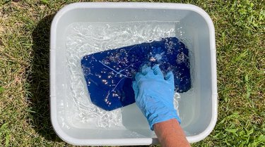 beautiful blue oxidized cyanotype fabric in the rinse water