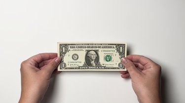A single one-dollar bill on a white background