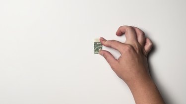 A single one-dollar bill folded four times