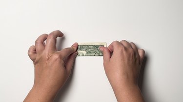 A single one-dollar bill folded twice