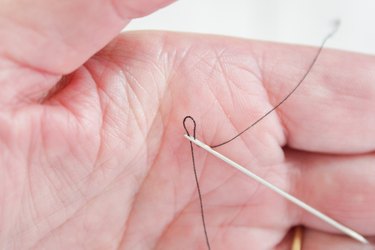 thread a needle using the palm of your hand
