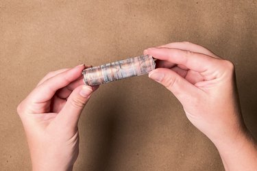 A stack of 50 pennies taped into a roll