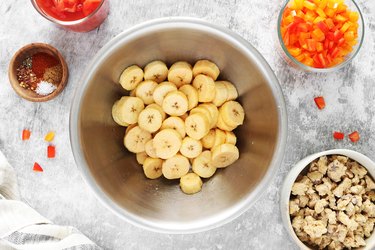 Toss plantain slices with oil and salt