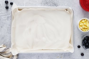 Spreading yogurt onto a baking sheet