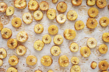 Plantain chips on parchment paper