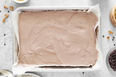 Chocolate yogurt spread onto a baking sheet
