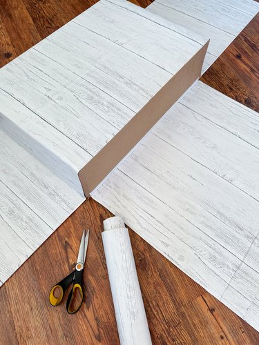 attach wood-look contact paper to the outside