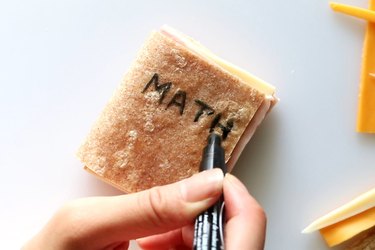 Decorate textbook sandwiches with a food coloring marker