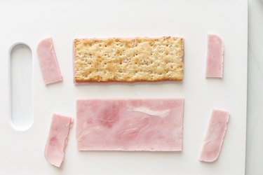 Cutting meat for ruler sandwich crackers