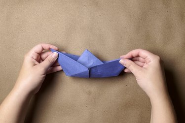 A boat made of blue construction paper