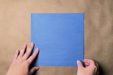 A square of blue construction paper