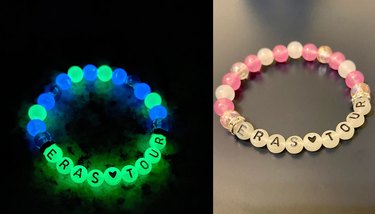 Two friendship bracelets, one glowing in the dark and the other pink and white reading "Eras Tour"
