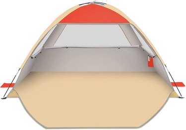 An orange and beige beach tent that can be fully enclosed. It has a large floor area and mesh windows.