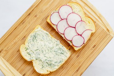 Assembling radishes with dill butter sandwiches.