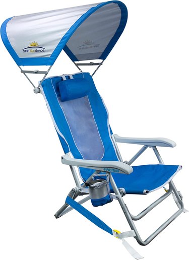 GCI SunShade Backpack Beach Chair against a white background. The chair is royal blue and has a large gray and blue sun shade attached to it.
