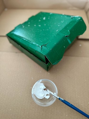 Splatter white paint to make box look like enamelware
