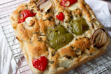Baked frog focaccia on a wire rack