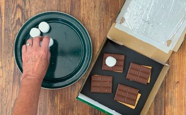 Fill solar oven with makings for s'mores