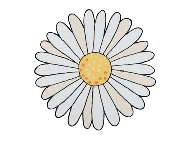 Decorative rug in the shape of a daisy. It has a nubby, hand-hooked texture and is 3 feet in diameter.