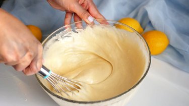 mixing cake batter in glass bowl