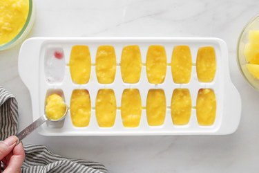 Add mango puree on top and freeze