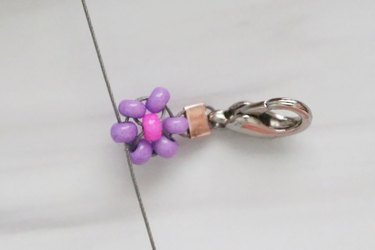 Purple and pink beaded daisy on wire