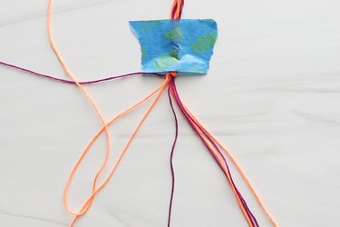 Knotting embroidery thread for a heart friendship bracelet