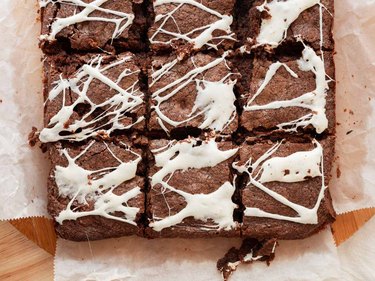 Brownies with spiderwebs on top made out of melted marshmallows.