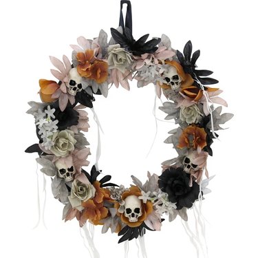 Halloween Autumn Wreath With Mini Skulls, Faded Flowers, and Faux Vines.