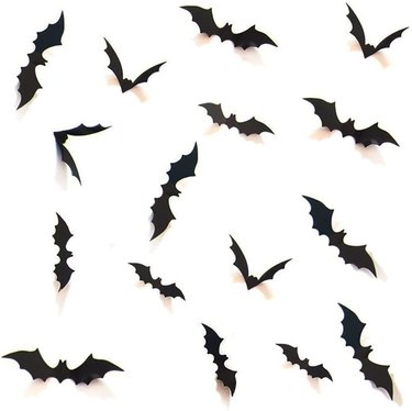 Decorative 3D Scary Bats Wall Decal Set from Amazon against a white wall. The bats come in various sizes.