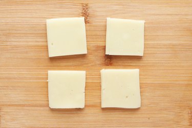 Cut provolone cheese into squares