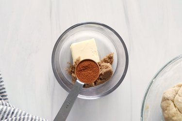 Ingredients for cinnamon sugar filling inside glass bowl