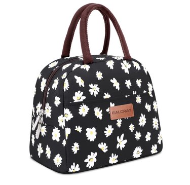 Tote-style Baloray Lunch Bag in black with white daisy print. The handles are brown and so is the zipper. It's in the shape of a vintage bowling bag.