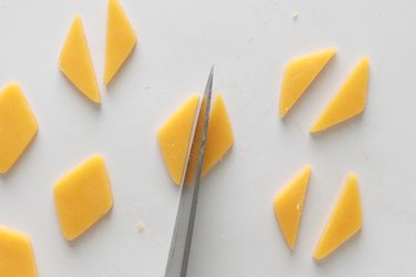 Cut cheese shapes in half