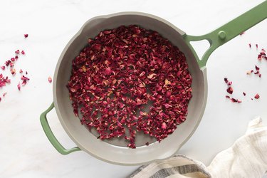 Boiling water and dried rose petals