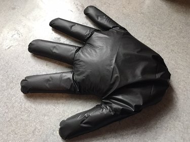 Glove filled with sand for fake Halloween hand