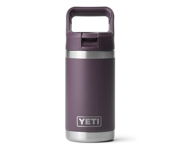 Purple Yeti water bottle made of stainless steel with a top handle.