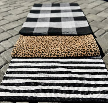 Striped, leopard and plaid doormats lined up