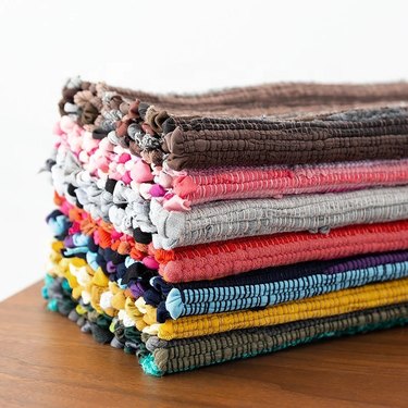 Stack of colored boho rugs