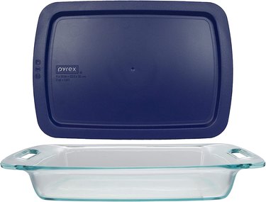 Pyrex 3-quart casserole dish and plastic storage lid, shown on a white ground