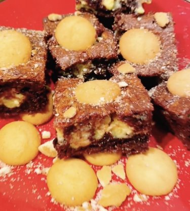 Brownies on a red background with vanilla wafers