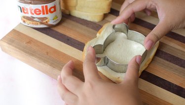 Cutting out bear shape with bear cookie cutter