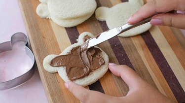 Spreading Nutella on bread slice
